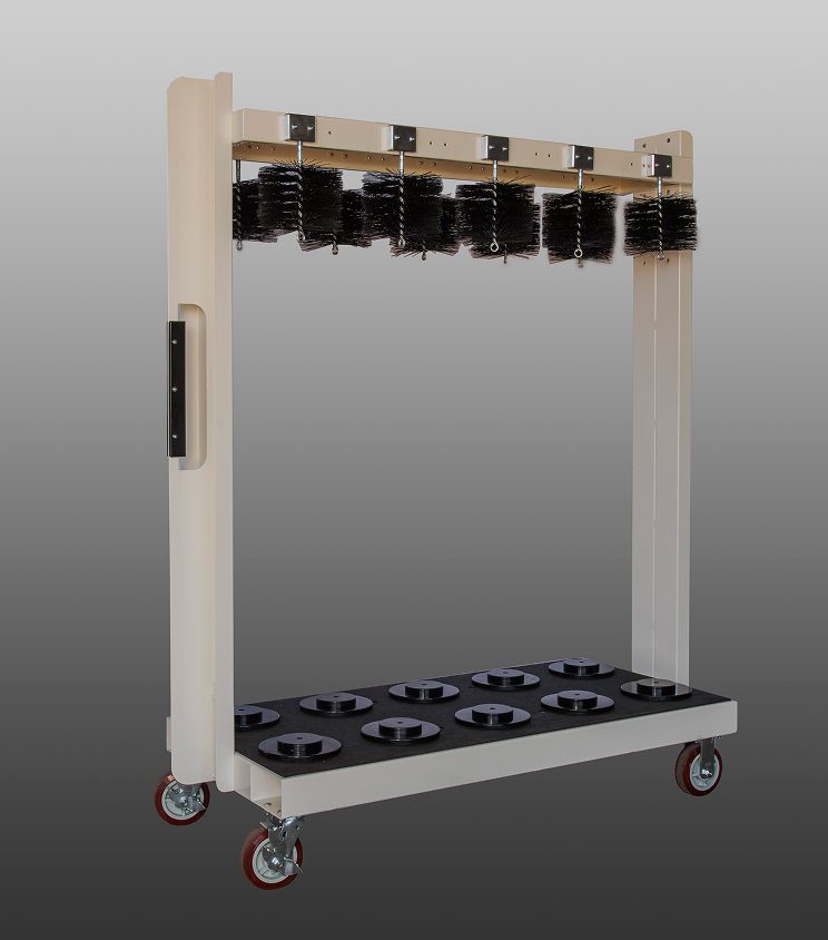 Industrial conveyor system with multiple black components and wheels.