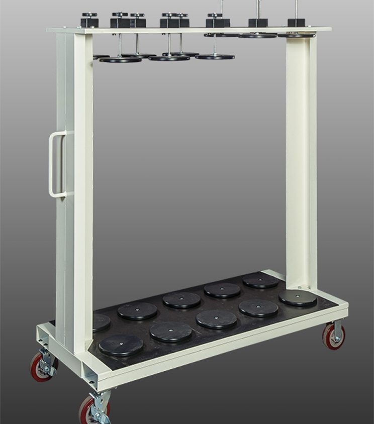 Mobile rack with multiple black trays on wheels for easy transport.