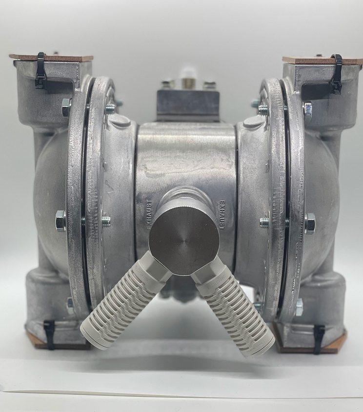 Front view of a metallic diaphragm pump with visible inlet and outlet ports.
