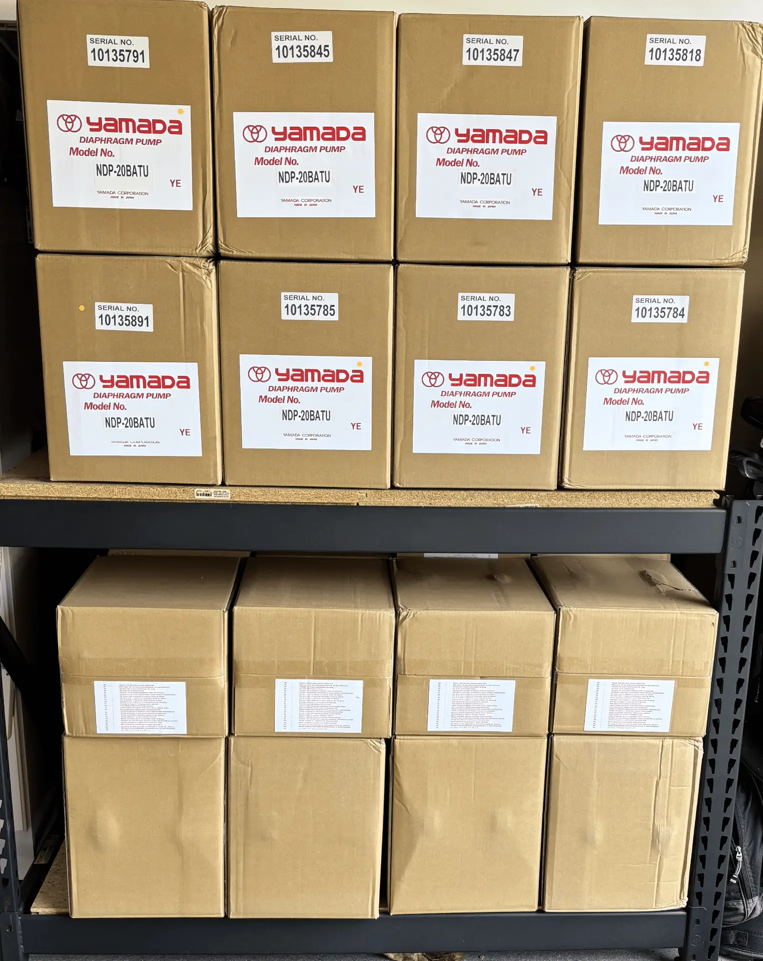 Stacked cardboard boxes with Yamada labels